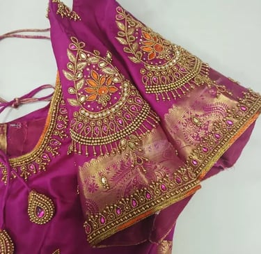 a purple blouse with a gold and pink blouse