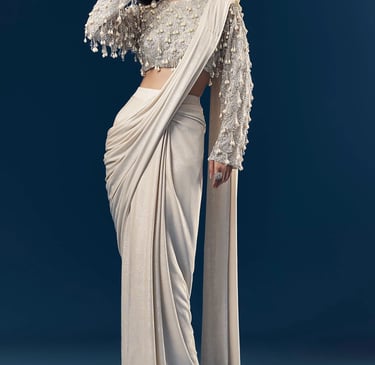 Modern silver saree draping with stylish pleats and designer blouse.