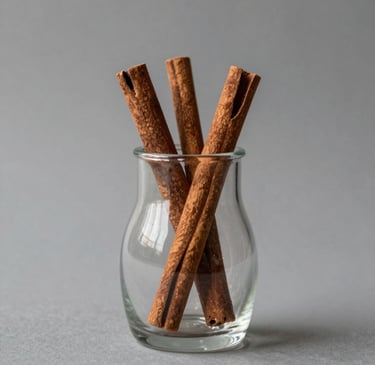 A sleek, modern vase with a smooth matte finish sitting on a wooden shelf against a soft neutral wall.