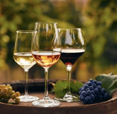 3 glasses of wine on a wine barrel