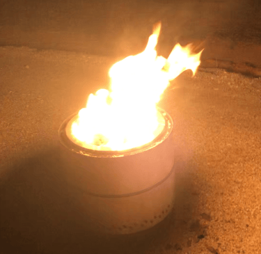 a smokeless fire pit with a fire in the middle of it