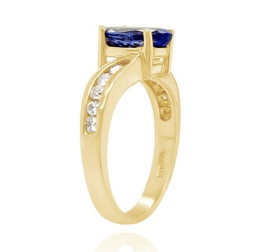a ring with a blue sapphire and diamond ring