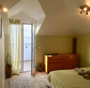 earth bedroom with a bed and a dresser