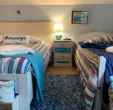 water bedroom with two beds