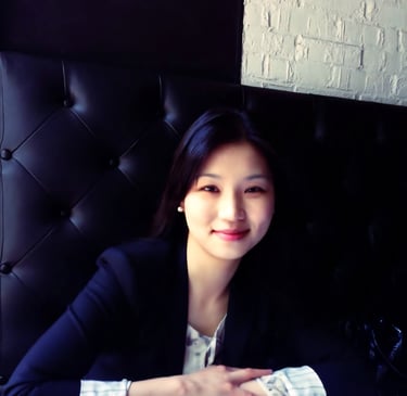 image of an asian woman smiling naturally in a professional attire