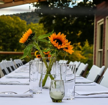 table set for guests, with daisy flowers