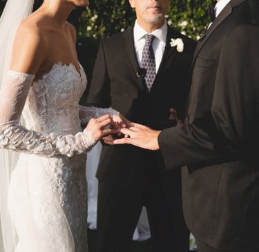 Bride and groom walking down the aisle holding hands