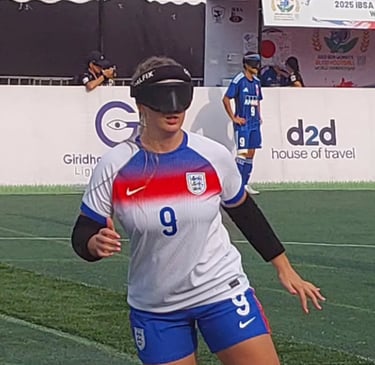 Football player wearing an England kit and protective eye shades during a blind football match