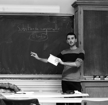 a man standing in front of a chalkboard with a blackboard