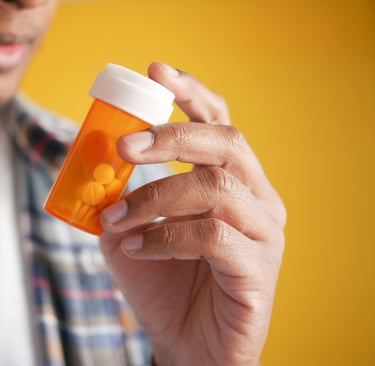 Male hold a prescription bottle