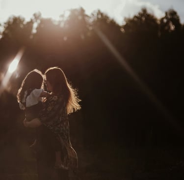 Mother and child share a gentle hug, representing the courage to express love and build connection