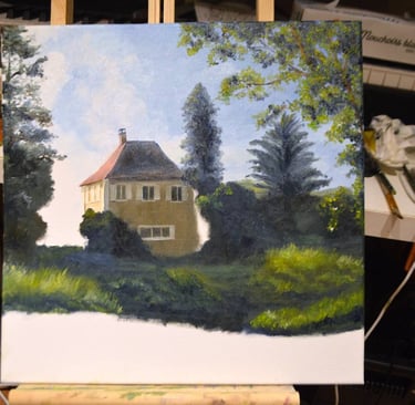 an unfinished painting of a house in a studio