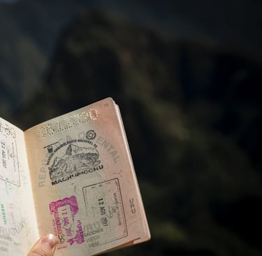 Hand holding an open passport with stamps, illustrating readiness for the U.S. student visa process