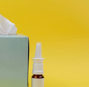 a tissue box with a tissue paper towel and a bottle of essential oils