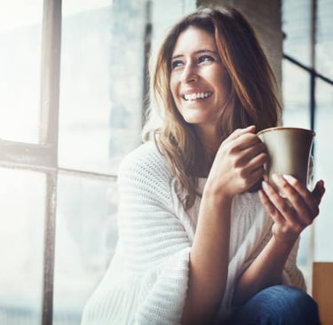 Elegant smiling by window