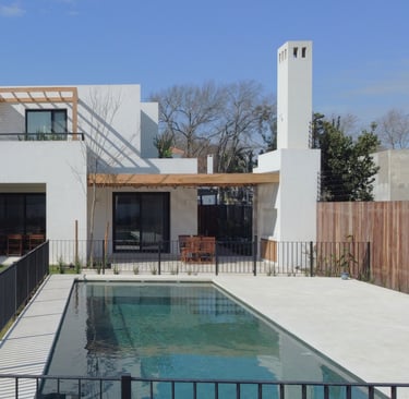 a house with a pool and a pool in the yard