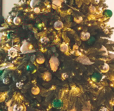 a christmas tree with presents in a room
