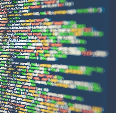Abstract pattern of multicolored code lines on computer screen, illustrating the digital revolution