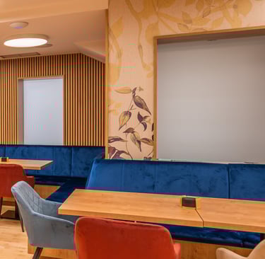 a restaurant with a wooden table and chairs