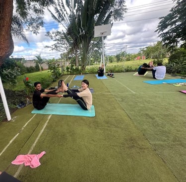 yoga participants trying partner pose for flexibility and endurance