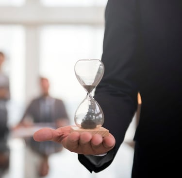 a man in a suit and tie is holding a hourglass hourglass hourglass