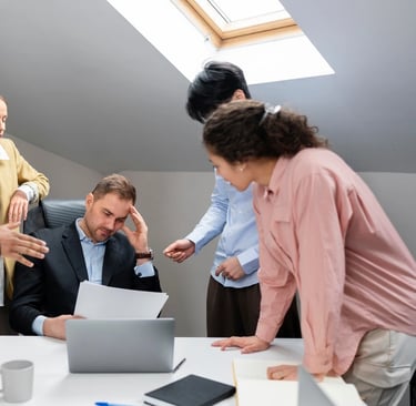 a group of people standing around a table