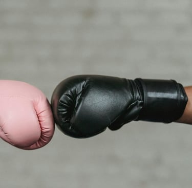 two people bumping hands in a boxing match
