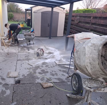 a man is working on a cement mixer