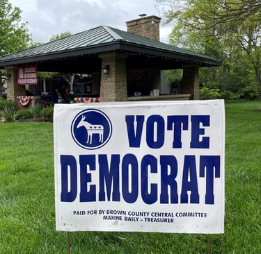 Yard sign reading Vote Democrat in front of downtown Nashville pavilion