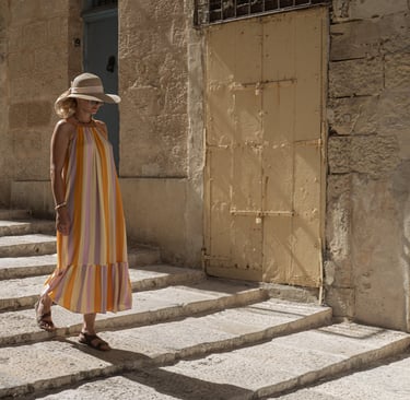Solo female traveler walking through historic Valletta