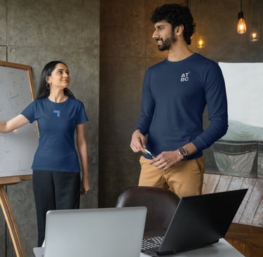 a man and woman standing in front of a white board board