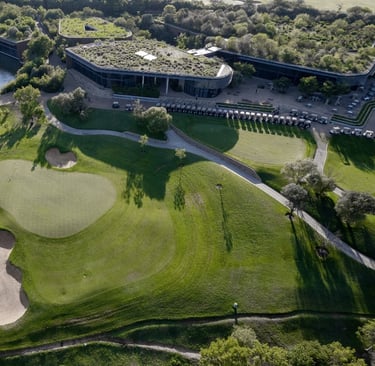 An aerial view of the 9th green and clubhouse at The Club at Steyn City, host venue of LIV Golf Sout
