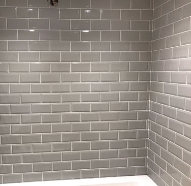 bathroom wall in malvern tiled by Lakes building and plastering services
