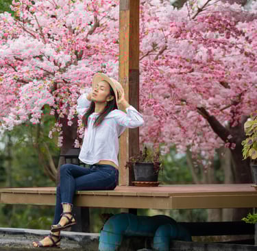 Solo traveler seated under torii gates in Kyoto