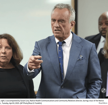a man in a suit and tie is pointing at a woman in a suit