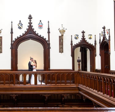 bride and groom in a romantic pose, groom kissing bride in castle, symmetrical composition