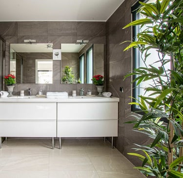 a bathroom with a large mirror and a shower