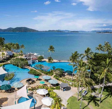 Swimming pool by the sea at Shangri-la Tanjung Aru Beach Resort