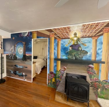 the living room, complete with a fireplace and vibrant wall art