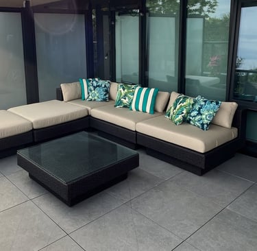 corner view of outdoor patio seating with custom cushions and pillows