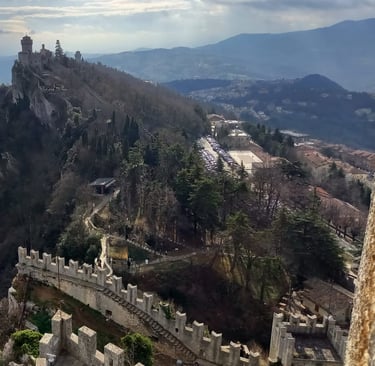 San Marino and the city wall and tower looking over to Italy
