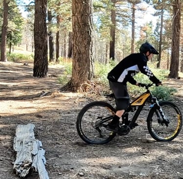 landing after a bump jump on a mountain bike