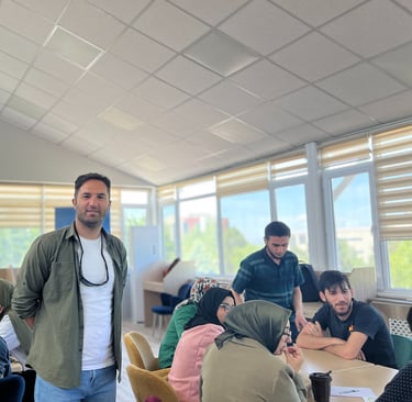 a man standing in a room with a bunch of people