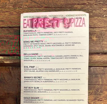 Vegan pizza menu on wooden table