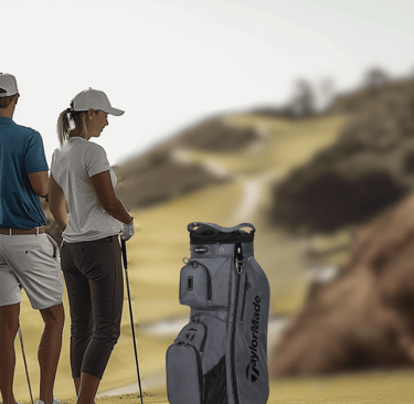 a man and woman golf players standing on a golf course