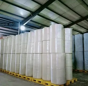 non-woven fabric rolls at warehouse