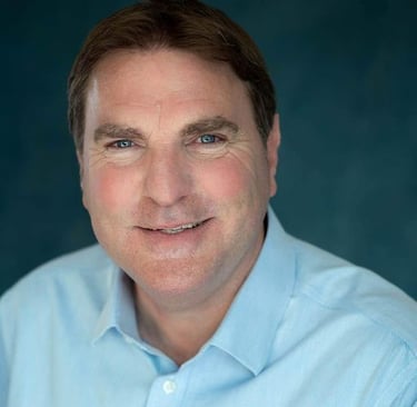 a man in a blue shirt and a blue shirt