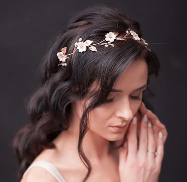 a woman wearing a white dress and a flower crown
