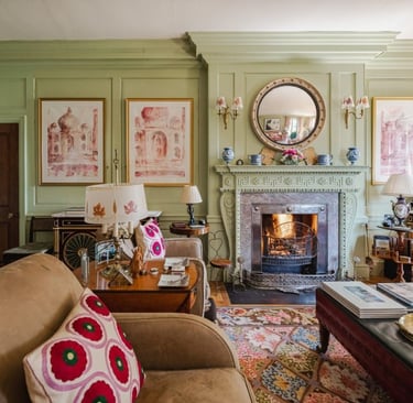 a living room with a fireplace and a fireplace Nour Nagy Designs London interior Design