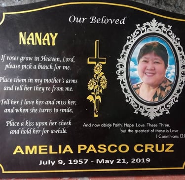 Engraved granite memorial stone with photo and golden accents for Amelia.
